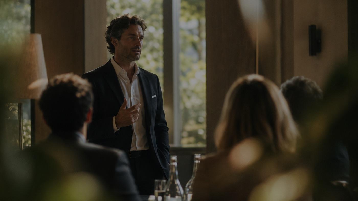 A hotel director briefing a management team